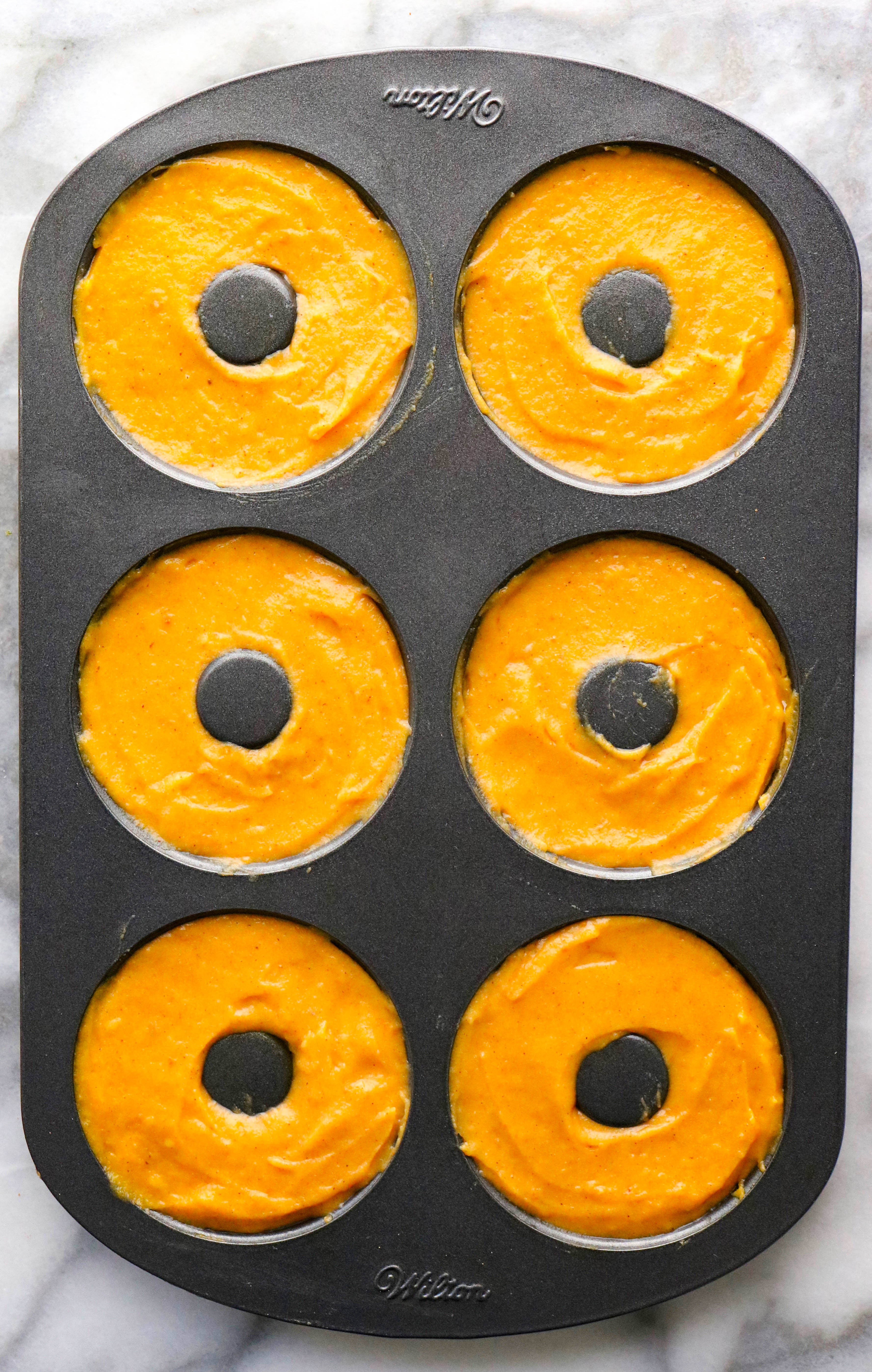 Pumpkin Donut Batter in a Donut Mold Pan