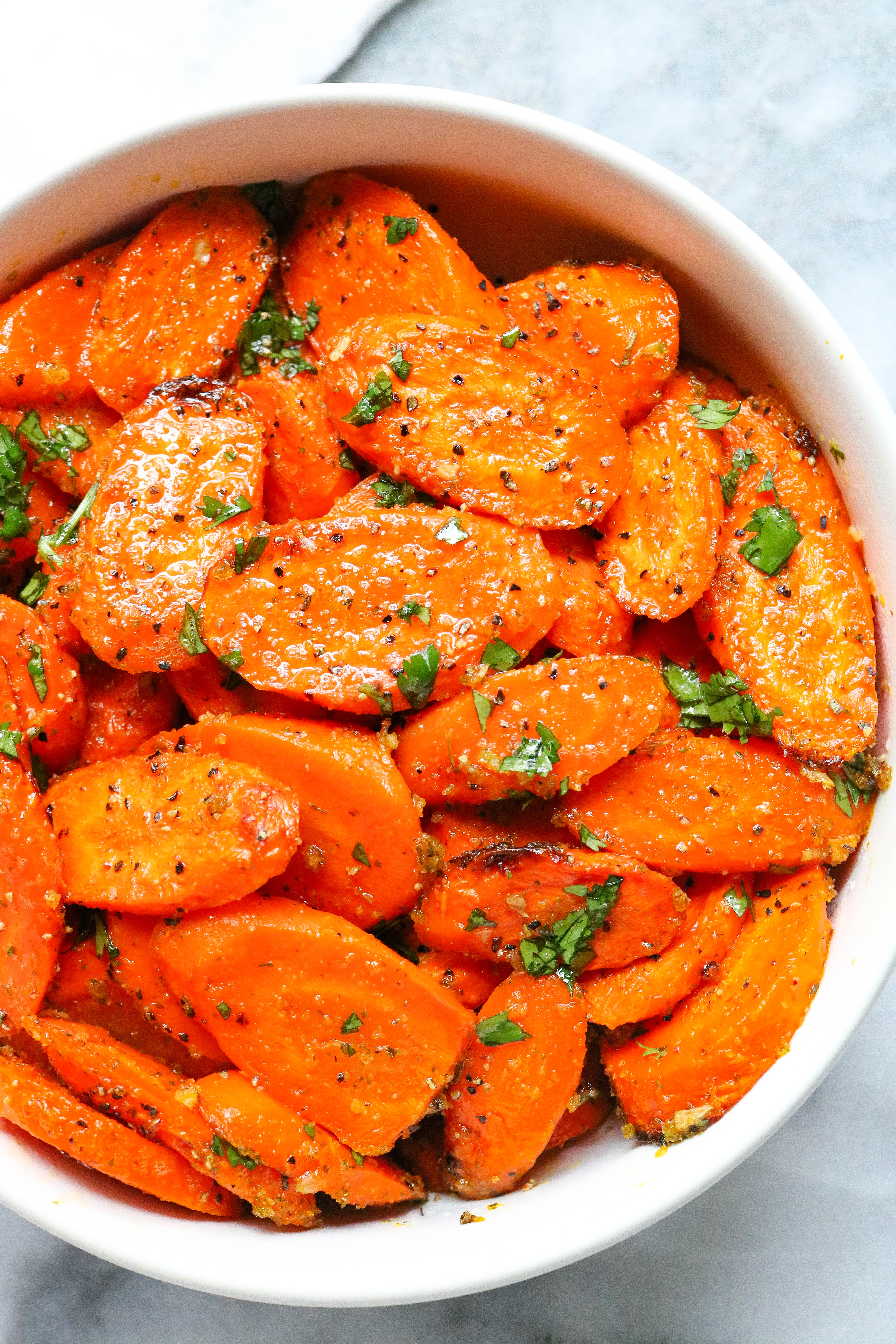 Easy ranch roasted carrots in a white bowl.