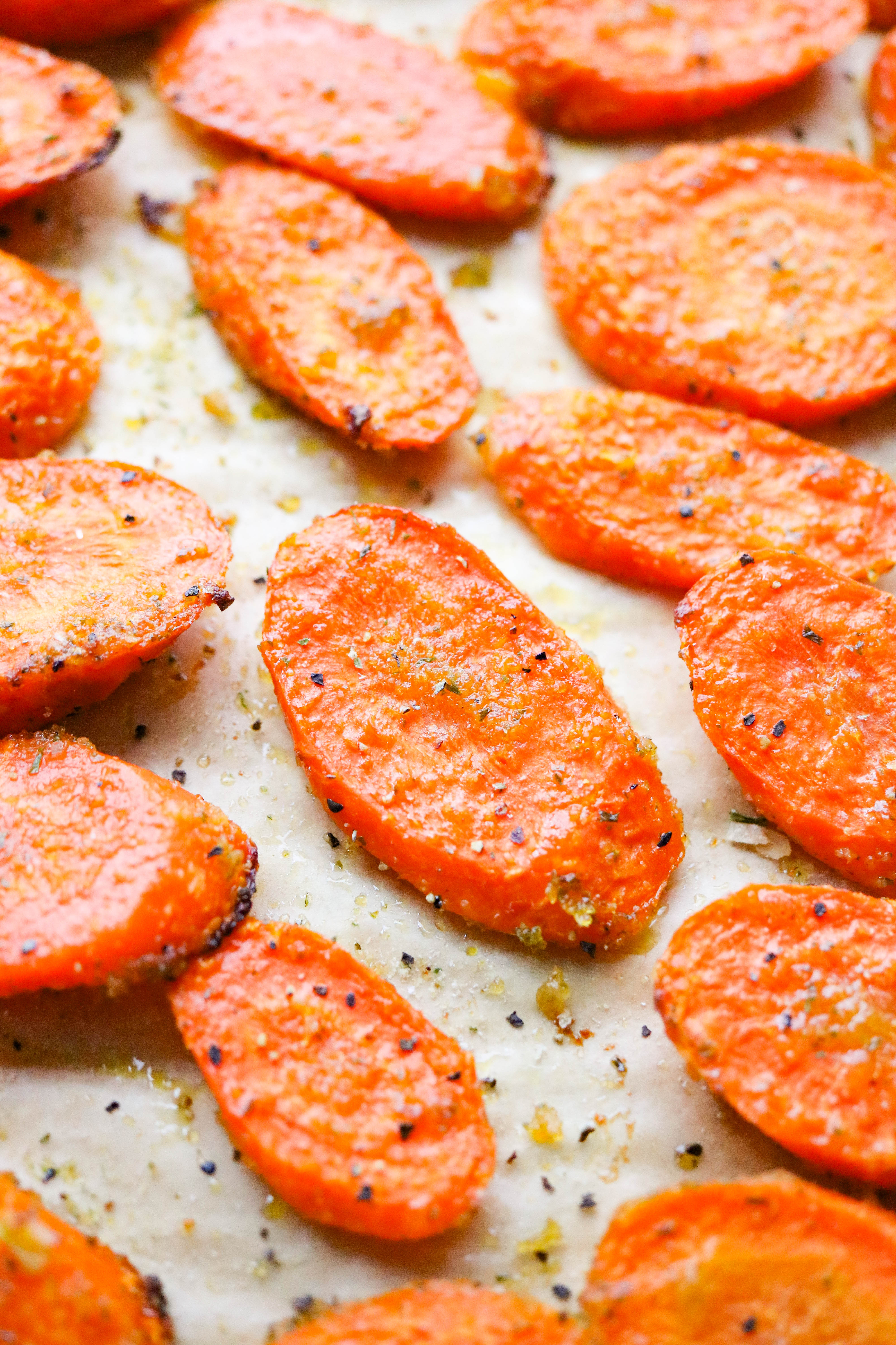 Easy ranch roasted carrots on a sheet pan on brown parchment paper