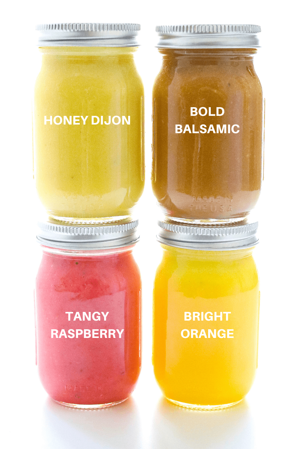 4 JARS OF COLORFUL SALAD DRESSING STACKED ON TOP OF ONE ANOTHER