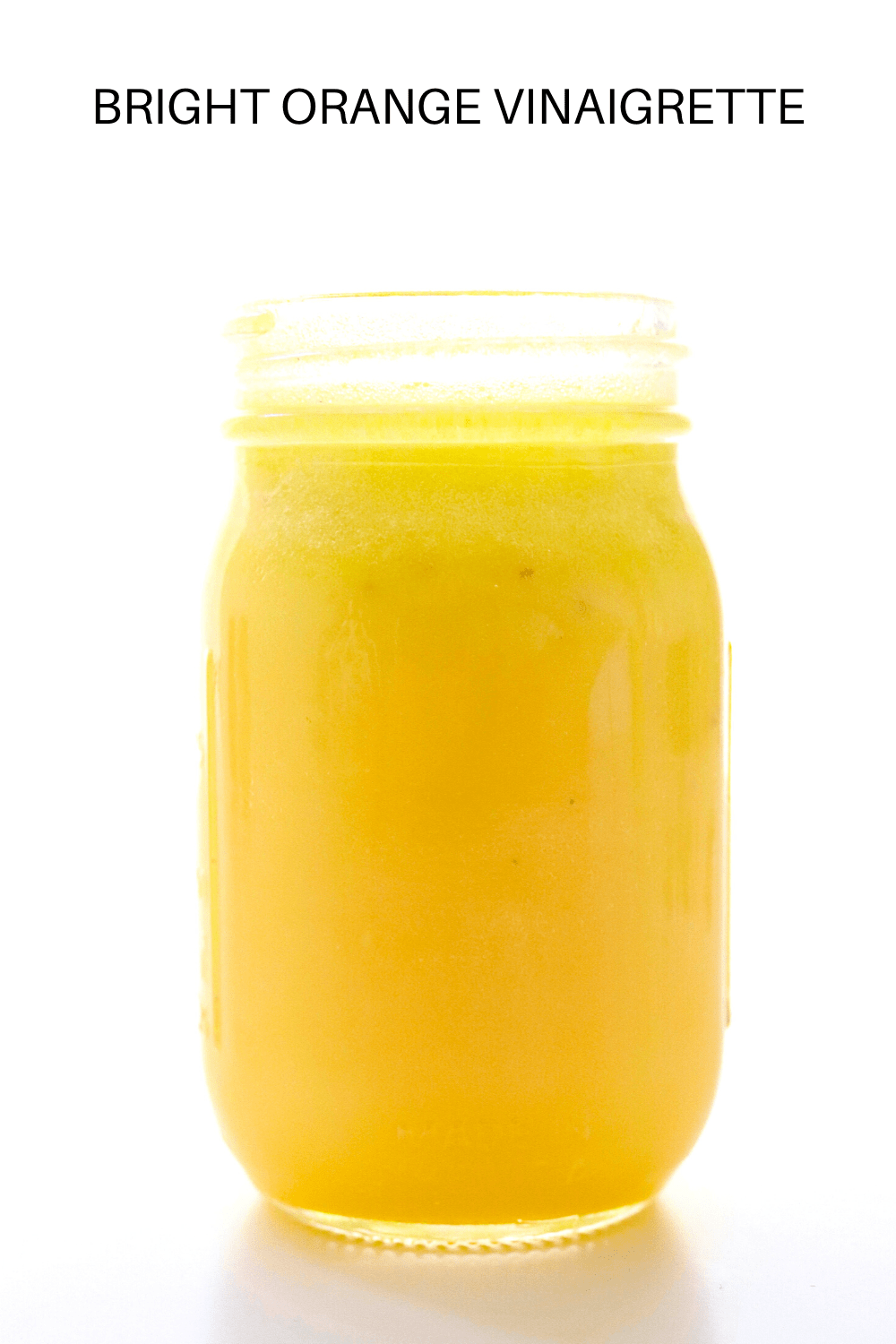 yellow dressing in a glass jar