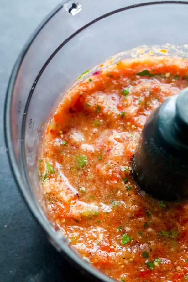 Close up of blended salsa in a food processor