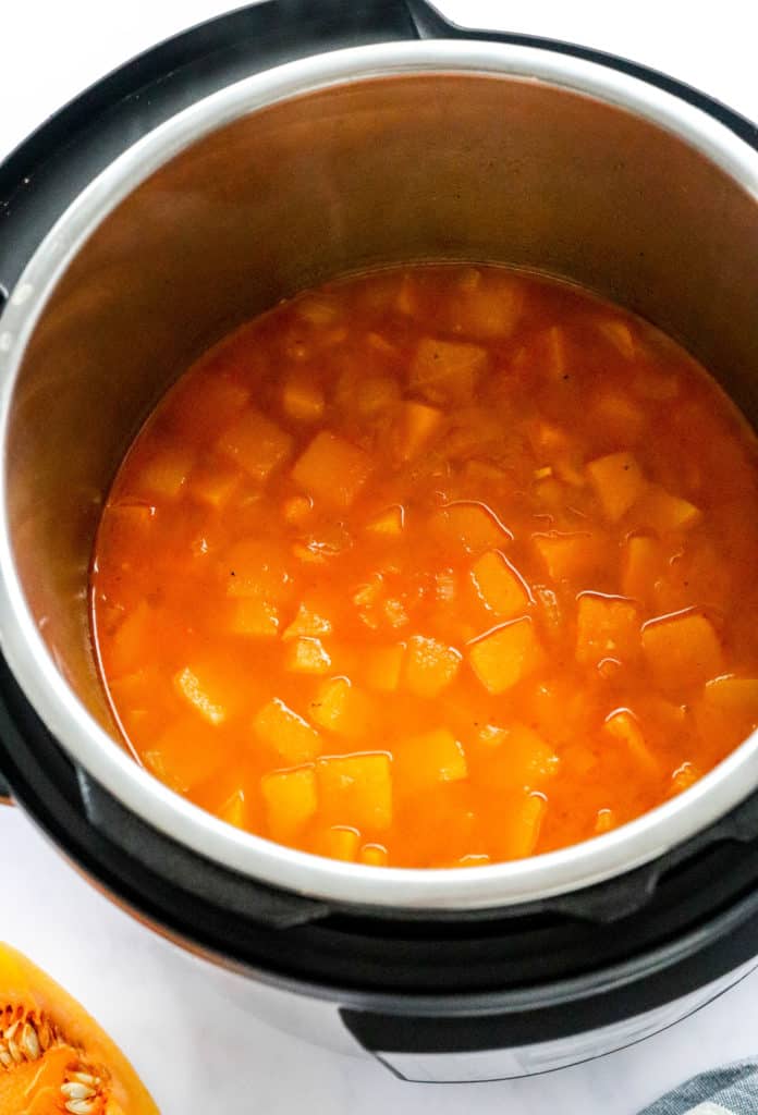 Cut cooked squash in stock inside an instant pot