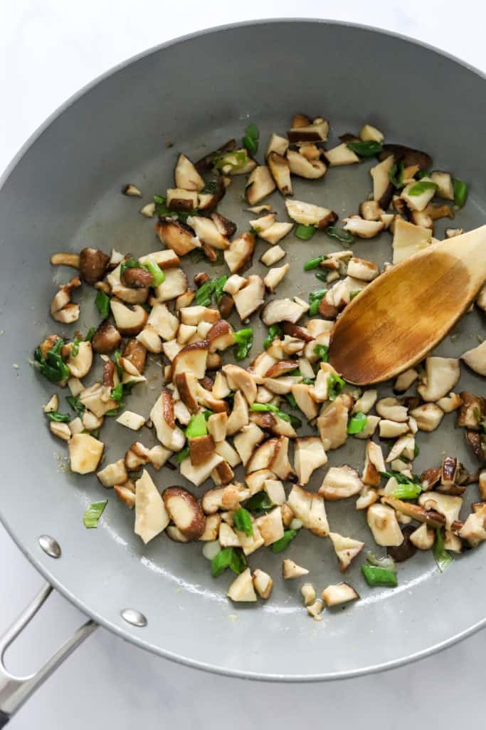 Cooking mushrooms in a pan.