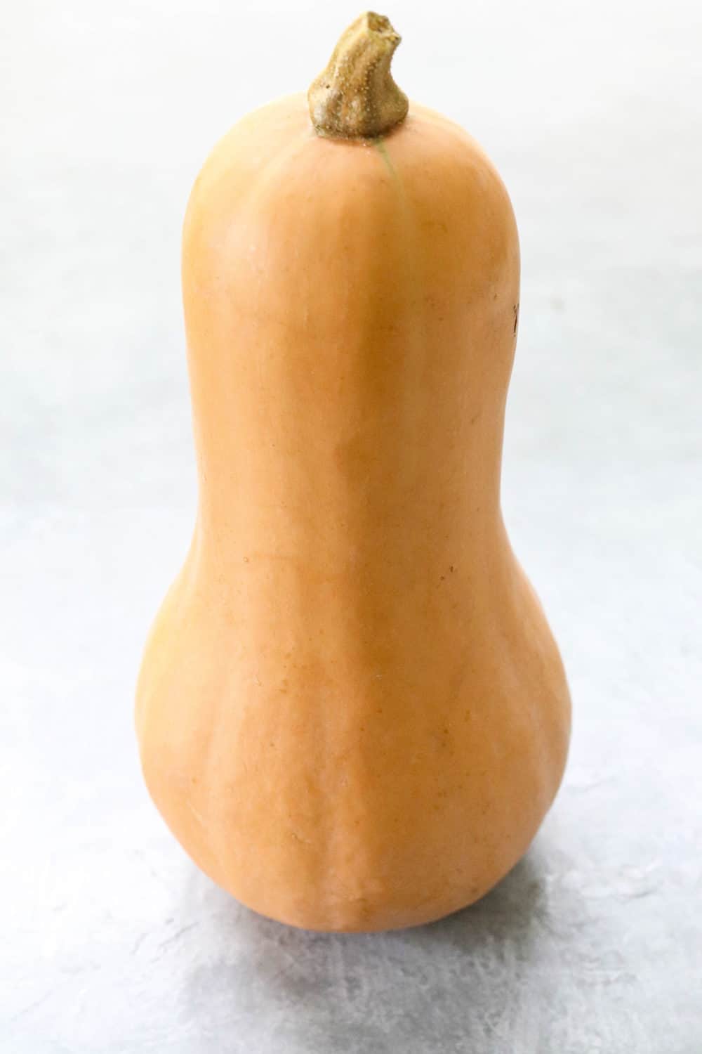 Whole butternut squash standing up. 