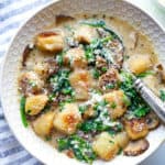 Creamy vegan gnocchi with spinach and mushrooms