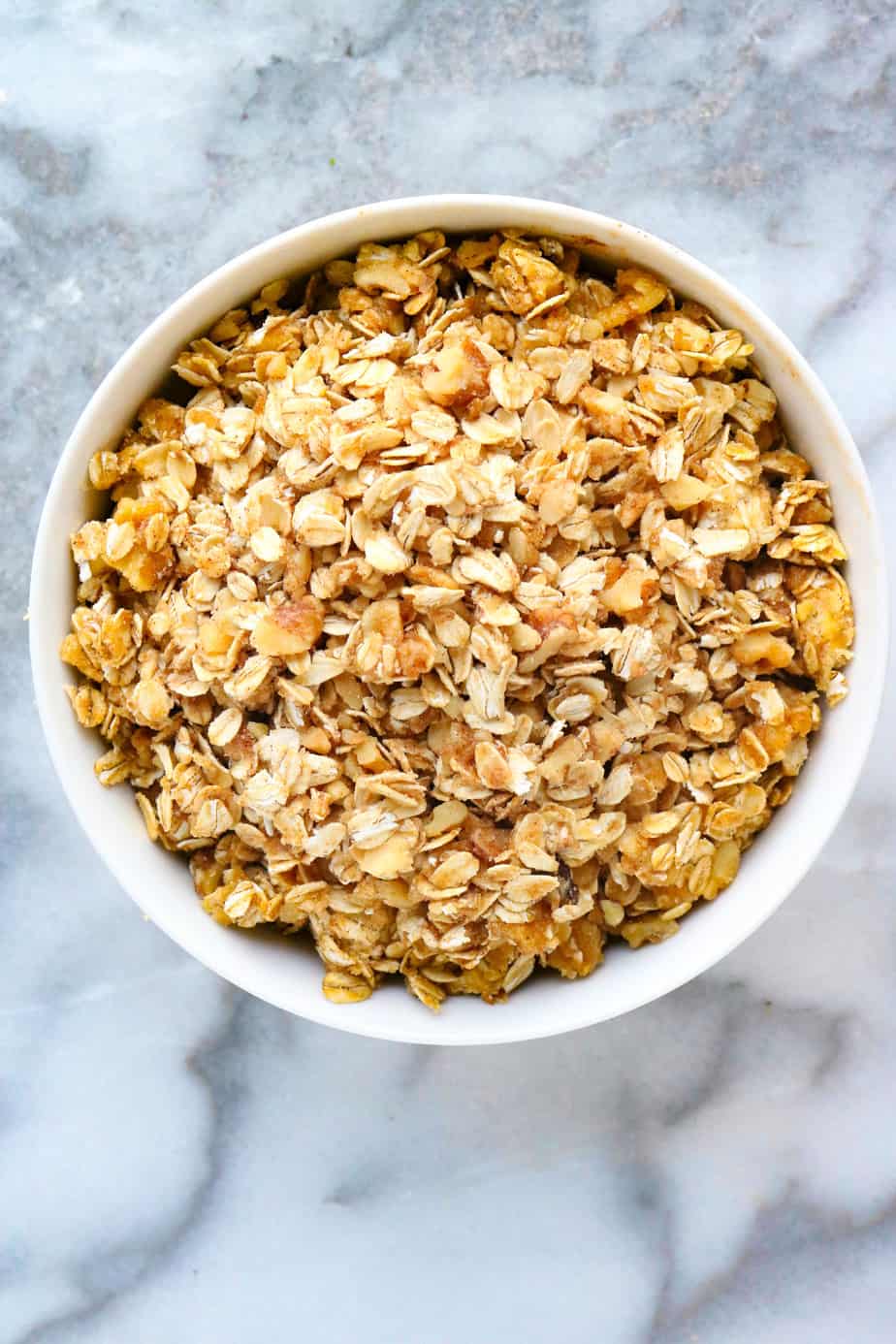 Walnut and oats crumble mix in a white bowl