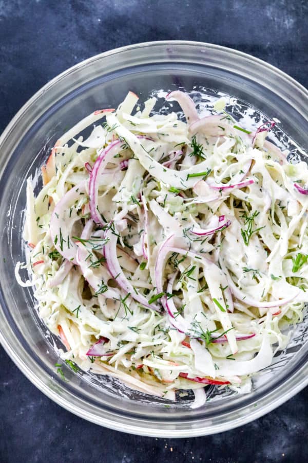 Creamy cabbage and fennel Cole slaw in a round glass bowl