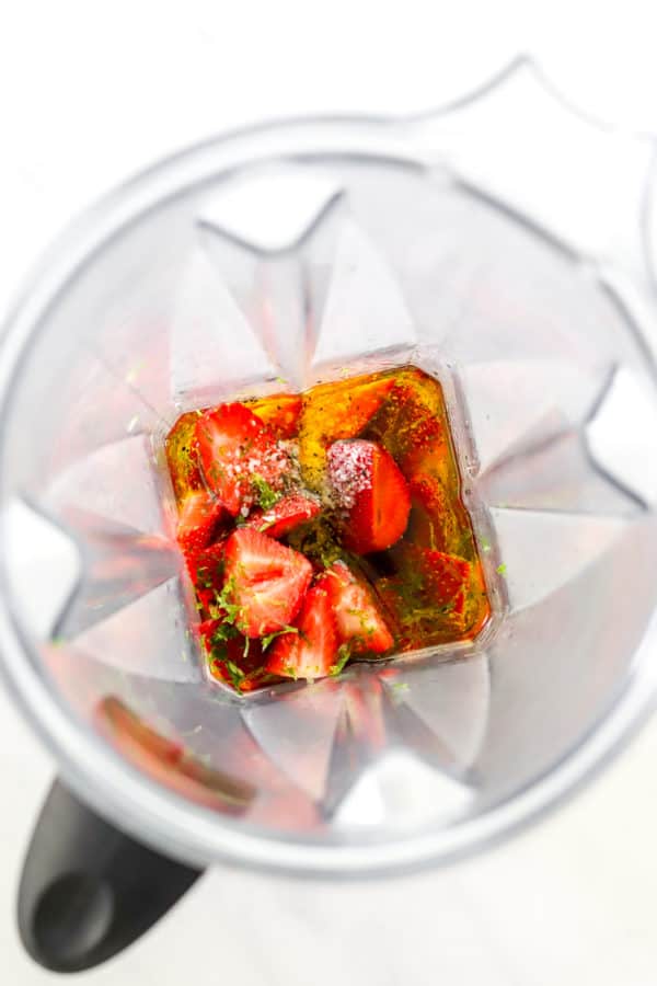 Strawberries, lime zest and olive oil in a blender