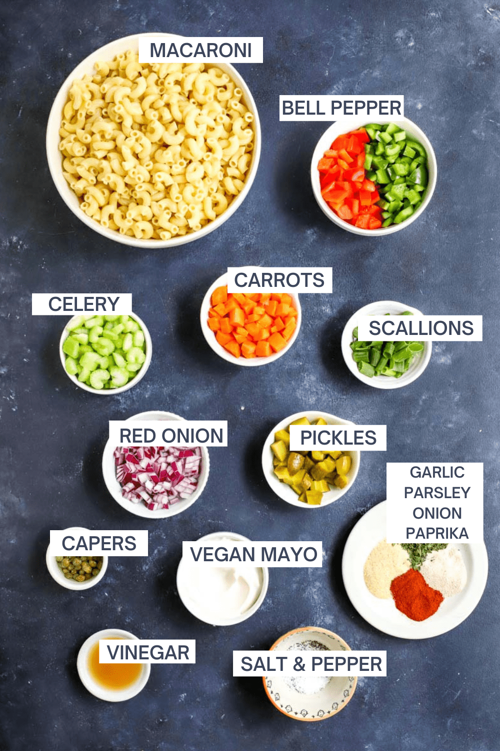 Ingredients for vegan macaroni salad with labels over each ingredient.