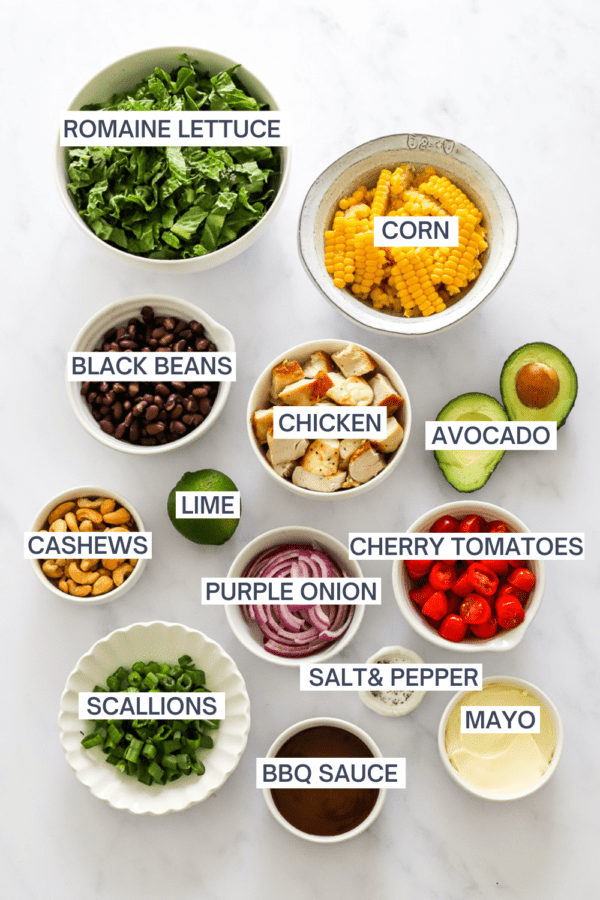 BBQ Chicken salad ingredients in bowls with labels over each ingredient.