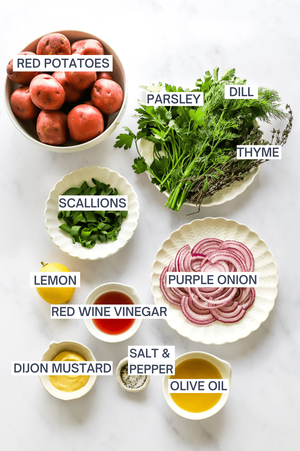 Healthy no mayo potato salad ingredients with labels over each ingredient. 