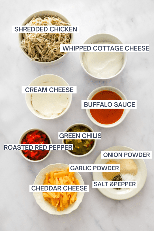 Ingredients for buffalo chicken dip with labels over each ingredient.