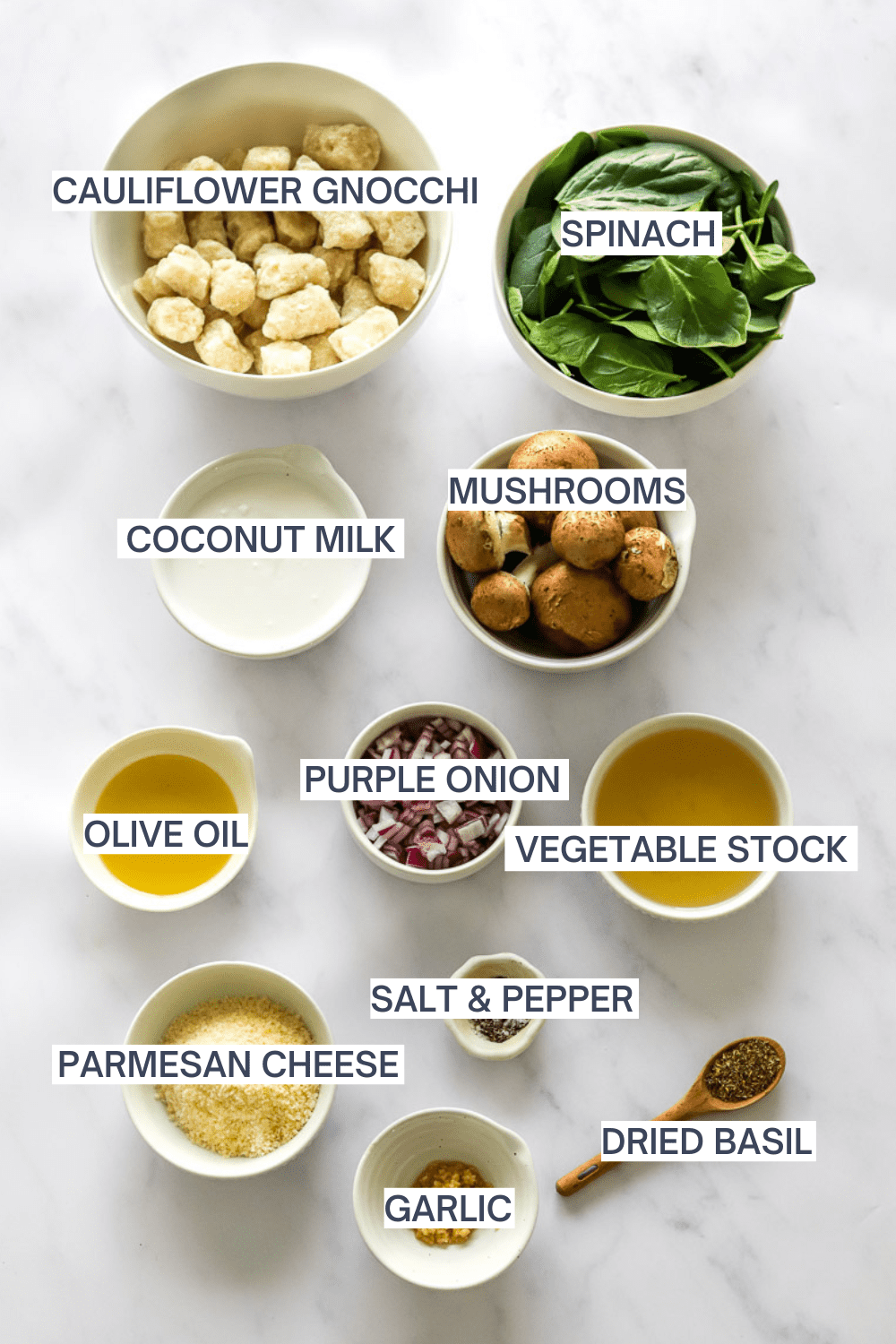 Ingredients to make creamy cauliflower gnocchi with trader joes cauliflower gnocchi with labels over each ingredient. 