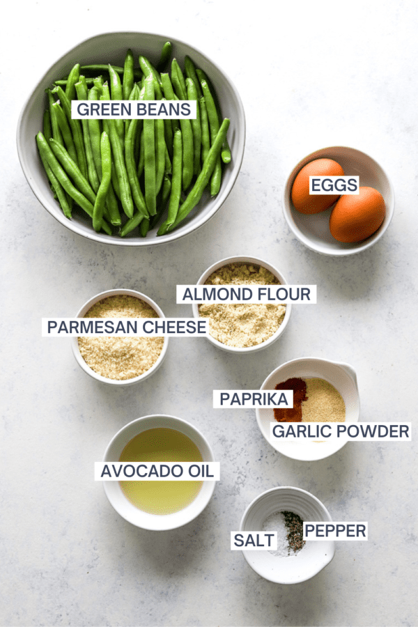 Ingredients for air fryer green bean fries with labels over each ingredient.