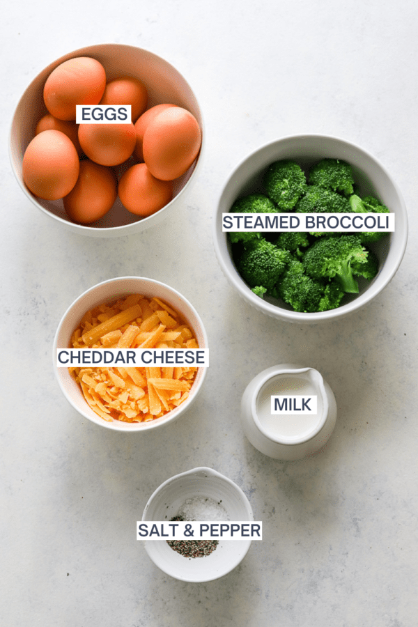 Ingredients for broccoli and cheddar crustless quiche with labels over each ingredient.