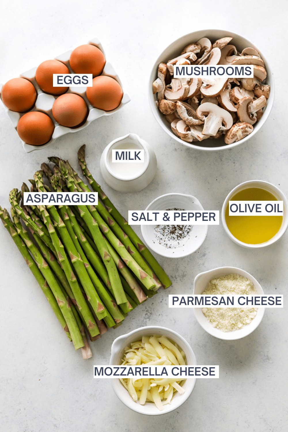 Ingredients for mushroom asparagus quiche with labels over each ingredient.