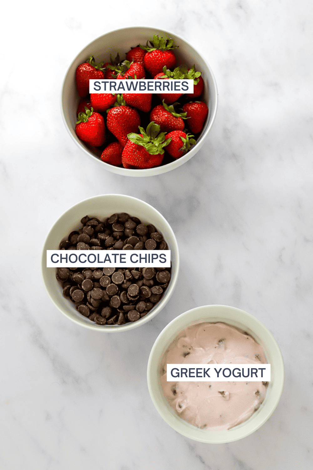 Ingredients for chocolate and yogurt strawberry dessert with labels over each ingredient.