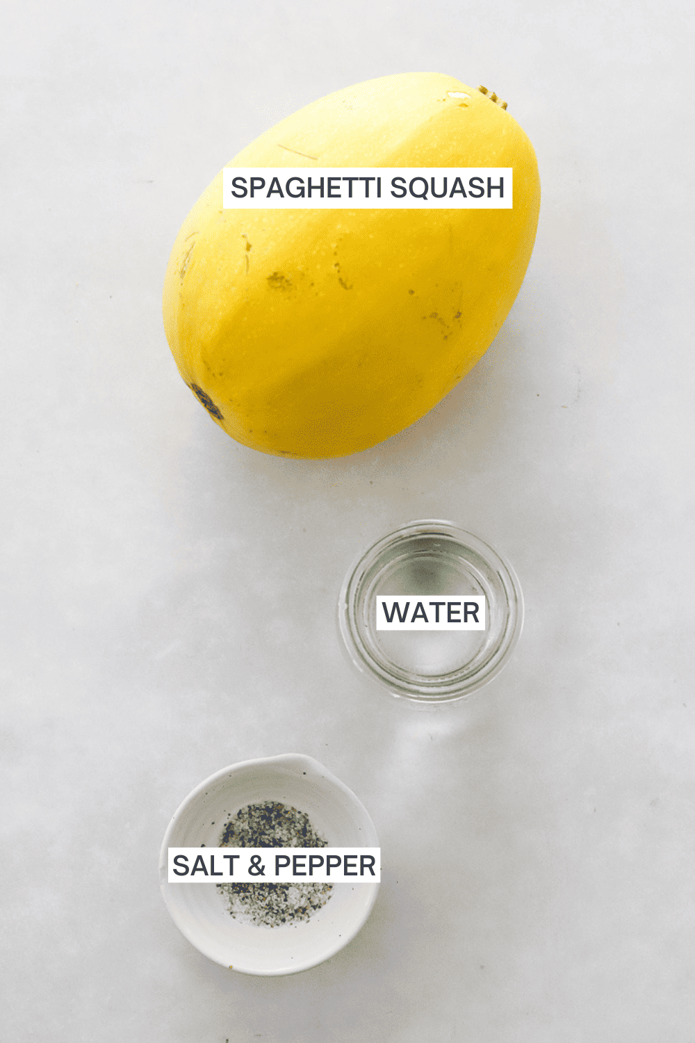 Ingredients for microwave spaghetti squash with labels over each ingredient.