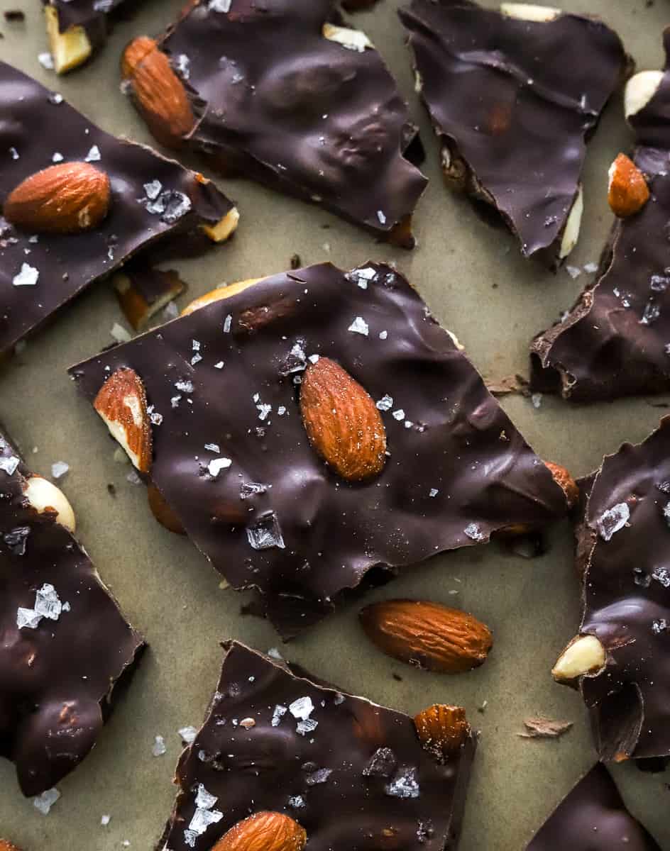 Broken up chocolate almond bark topped with sea salt.