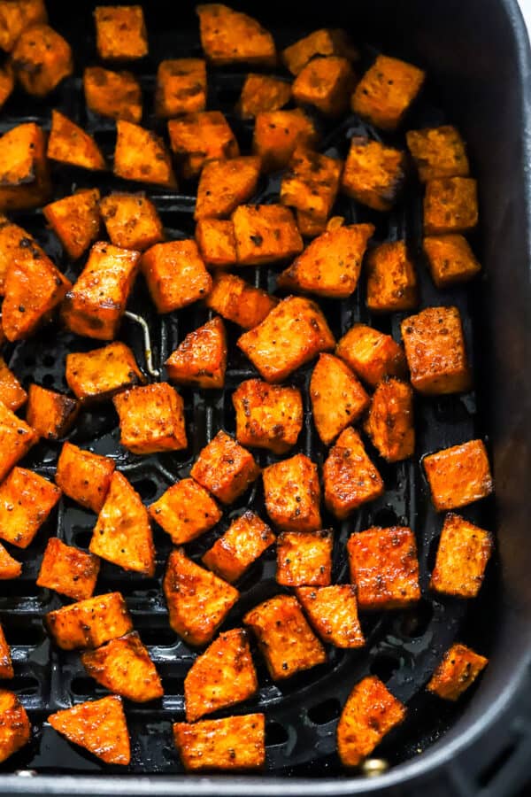 Cooked, diced sweet potato in the air fryer.