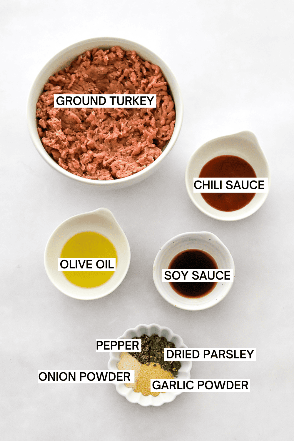 Ingredients for air fryer turkey burgers with labels over each ingredient.