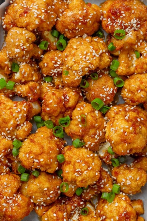 Veggie wings made with cauliflower topped with chopped green onions.