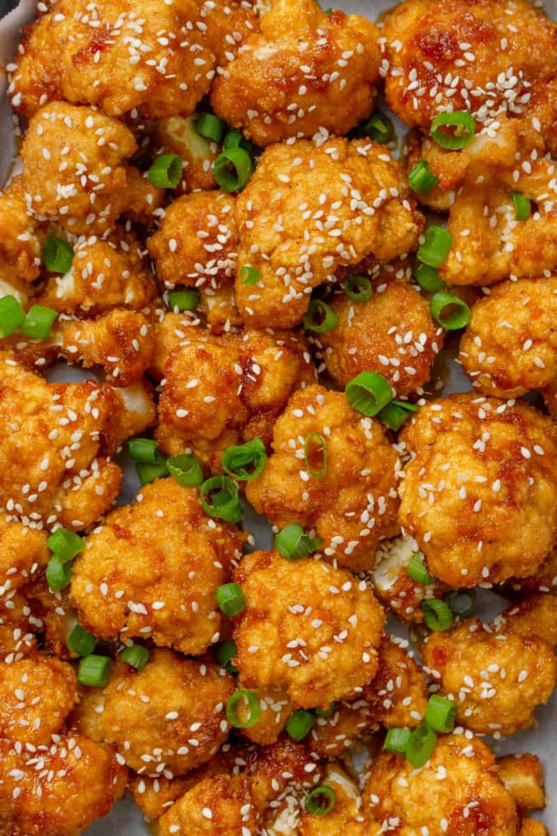 Veggie wings made with cauliflower topped with chopped green onions.