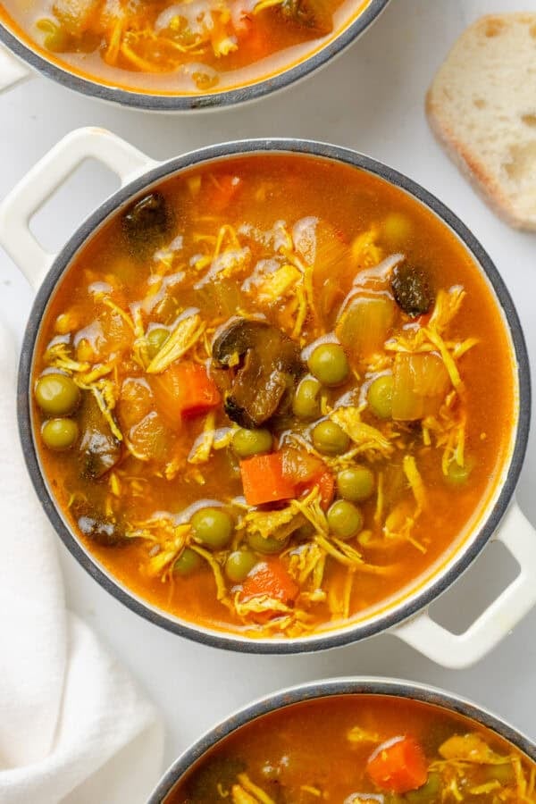 Small pots filled with homemade healthy chicane soup.