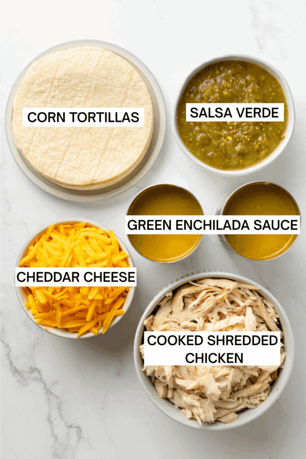 Ingredients for green chicken enchiladas in bowls with labels over each ingredient.