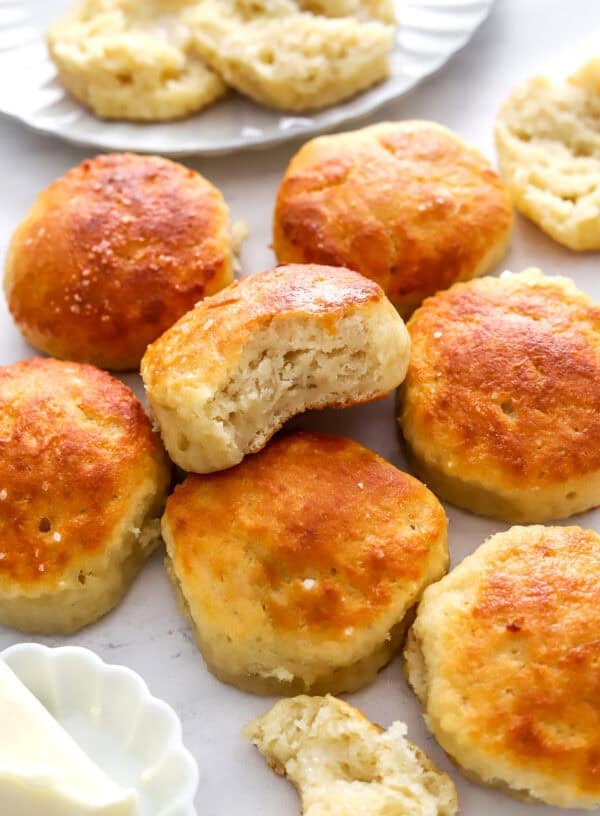 Pile of biscuits with a bite taken out of one.