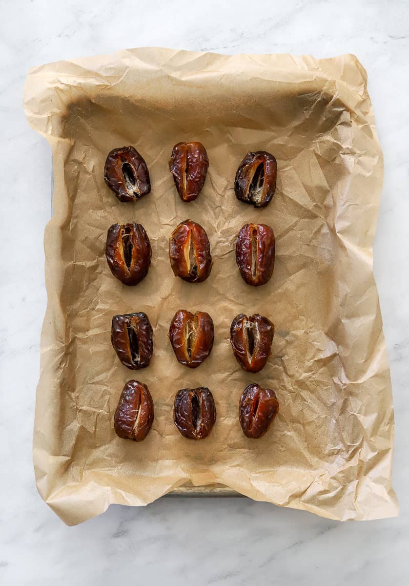 Pan of sliced dates with the pits removed from them.