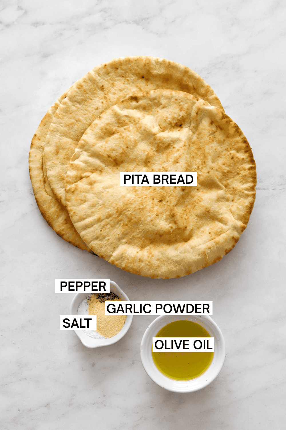 Ingredients for air fryer pita chips with labels over each ingredient. 