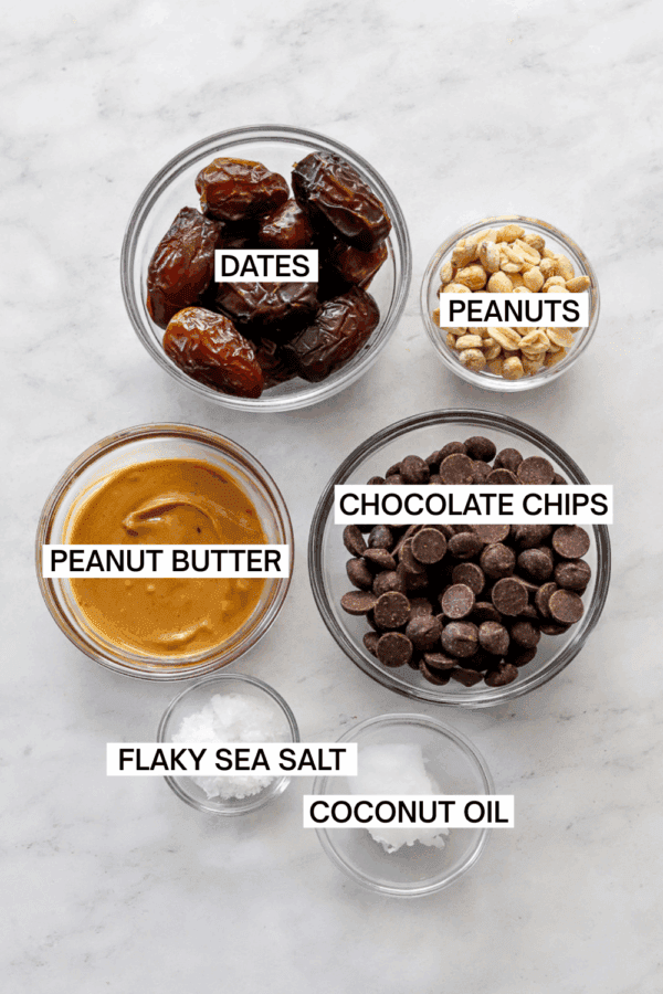 Ingredients for snickers dates in bowls with labels over each ingredient.