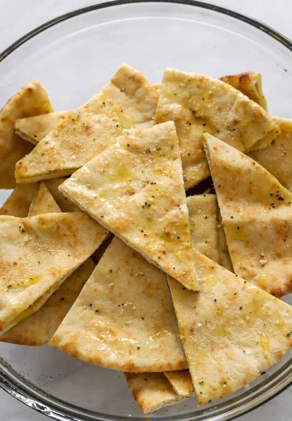 Pita triangles in a mixing bowl.