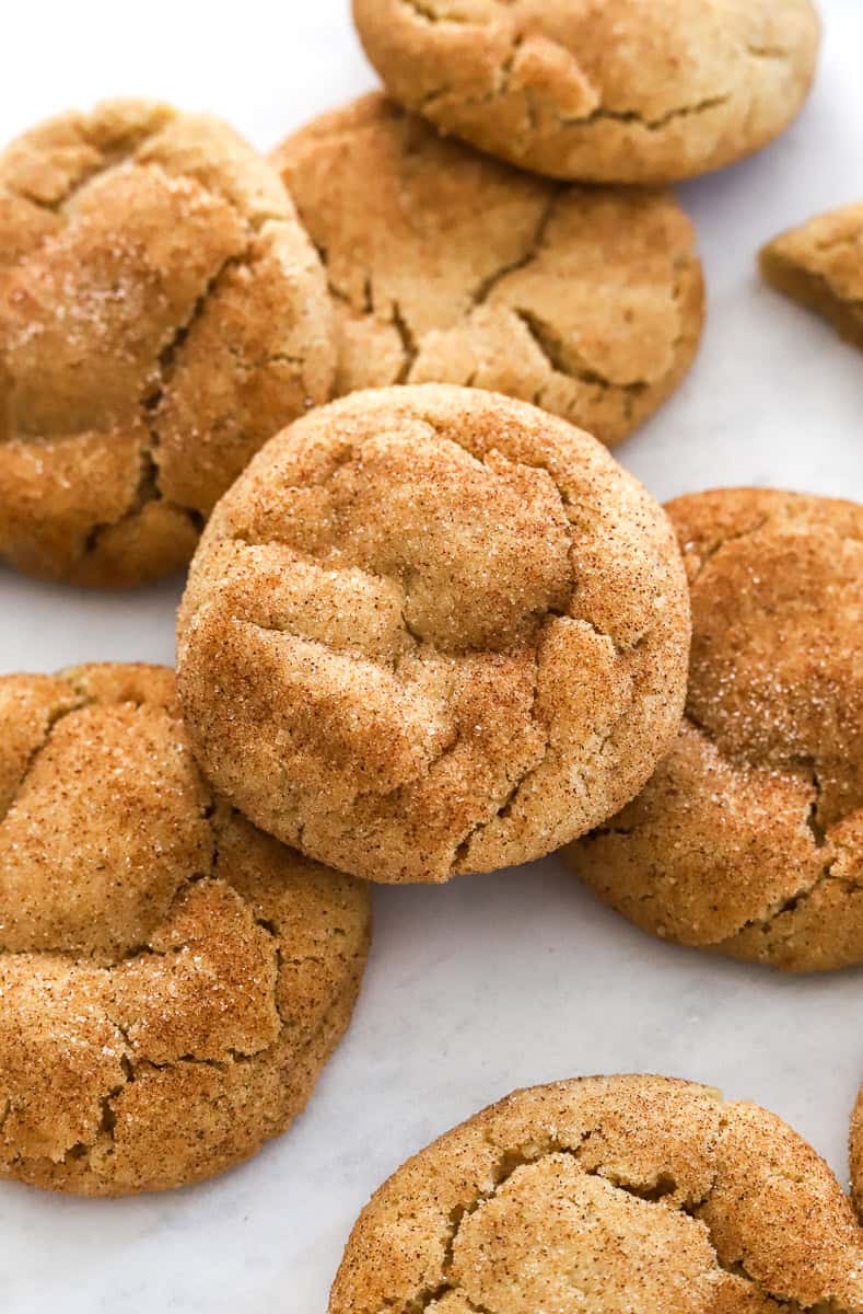 Thick snickerdoodle cookies with cinnamon sugar on them.
