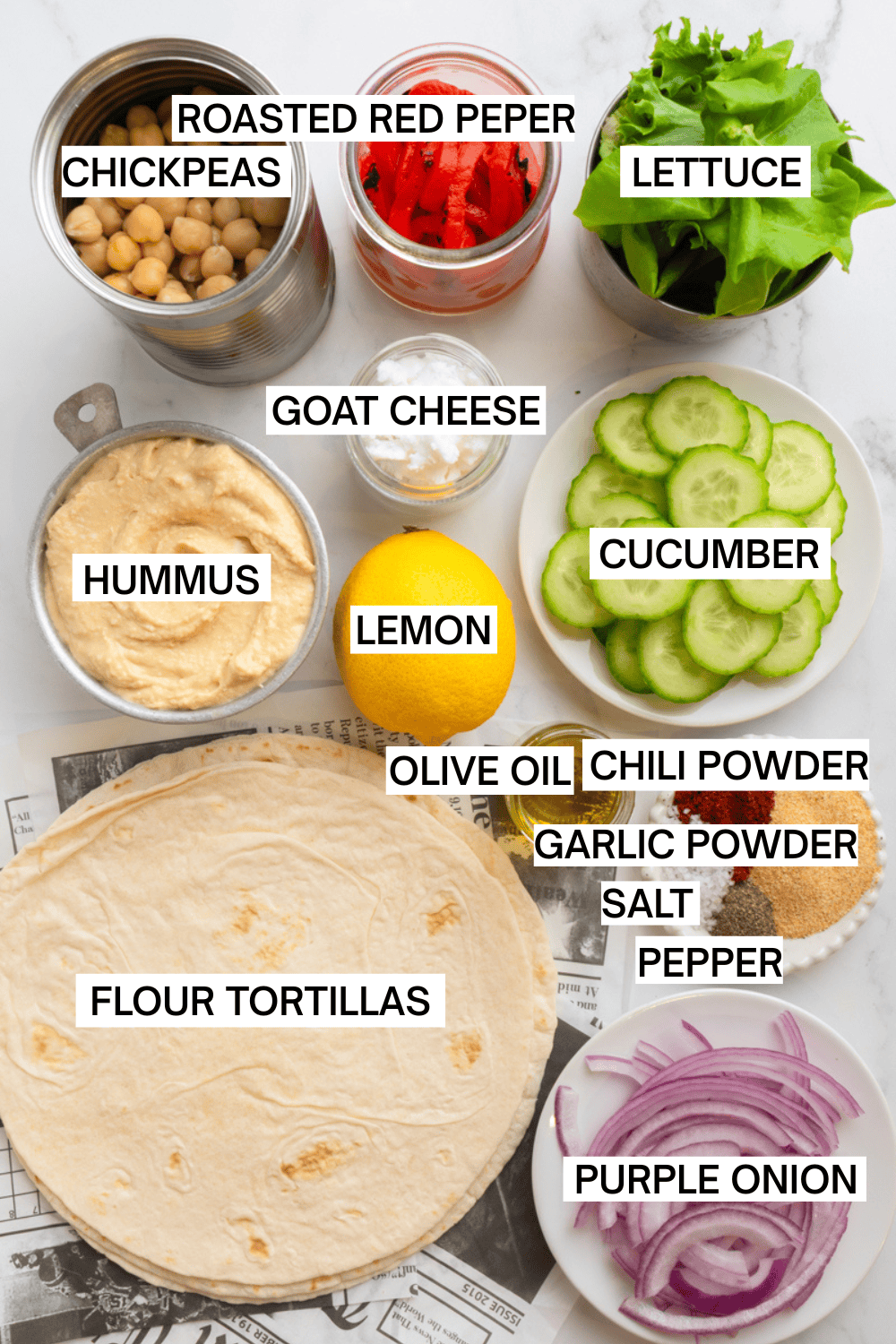 Hummus wrap ingredients in containers with labels over each ingredient. 