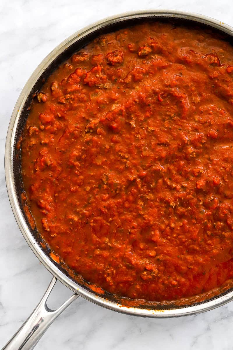 Simmered marinara sauce in a saute pan.