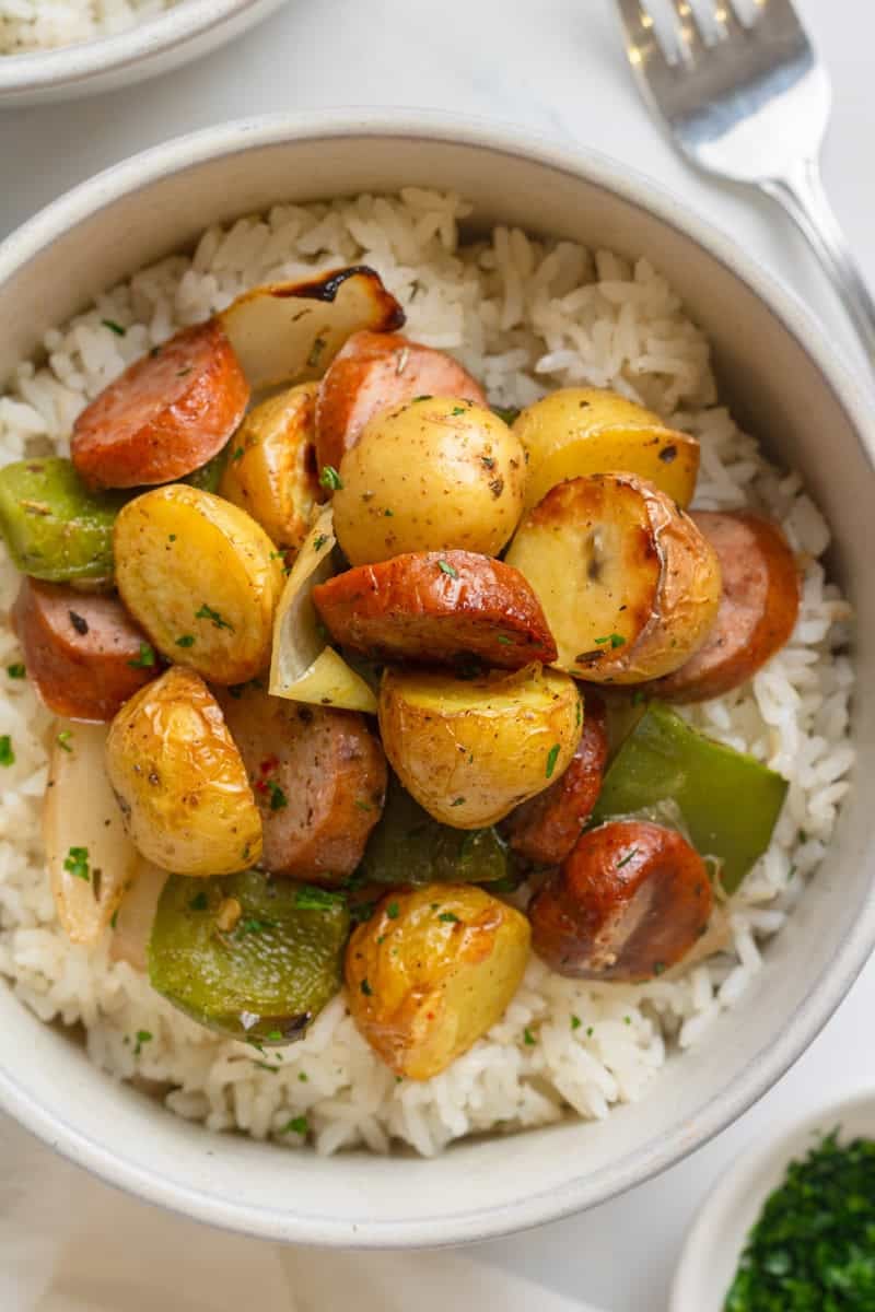 Bowl filled with air fryer sausage and potatoes.