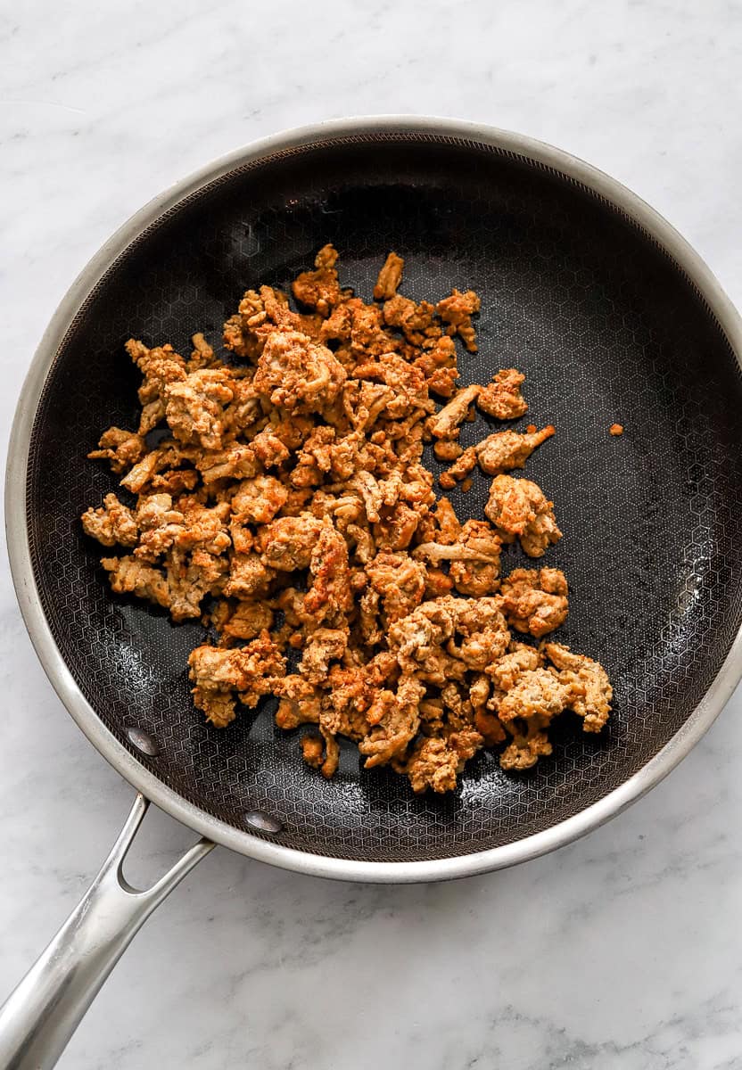 Cooked ground turkey in a sauté pan.