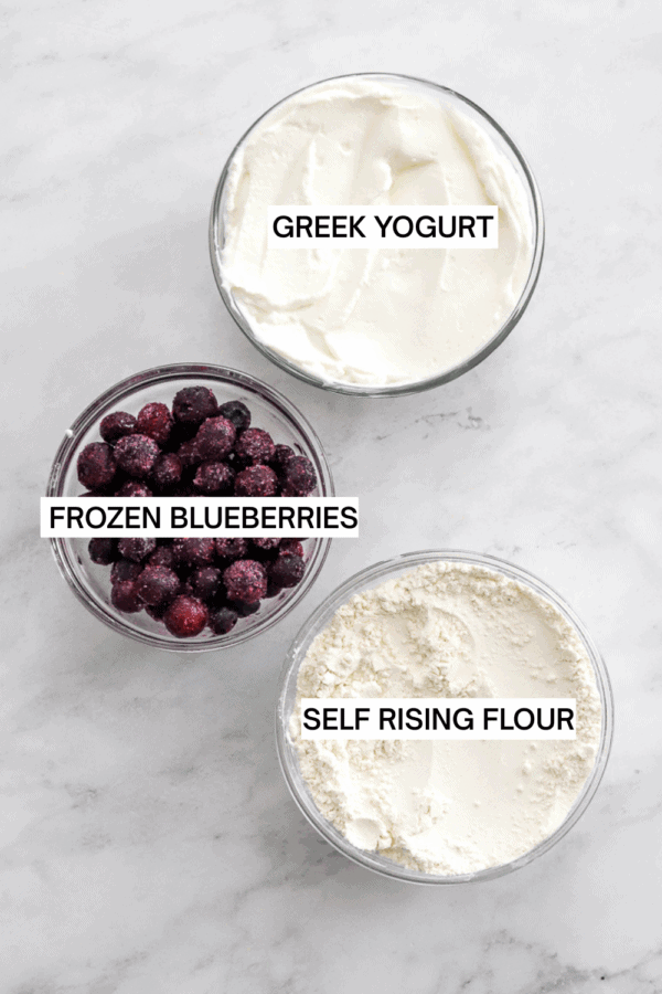 Ingredients for air fryer blueberry bagels in bowls with labels over each ingredient.