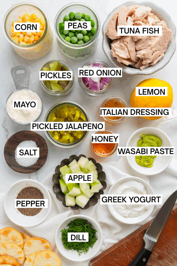 Ingredients for Matthew Mcconaughey's tuna salad in bowls with labels over each ingredient.