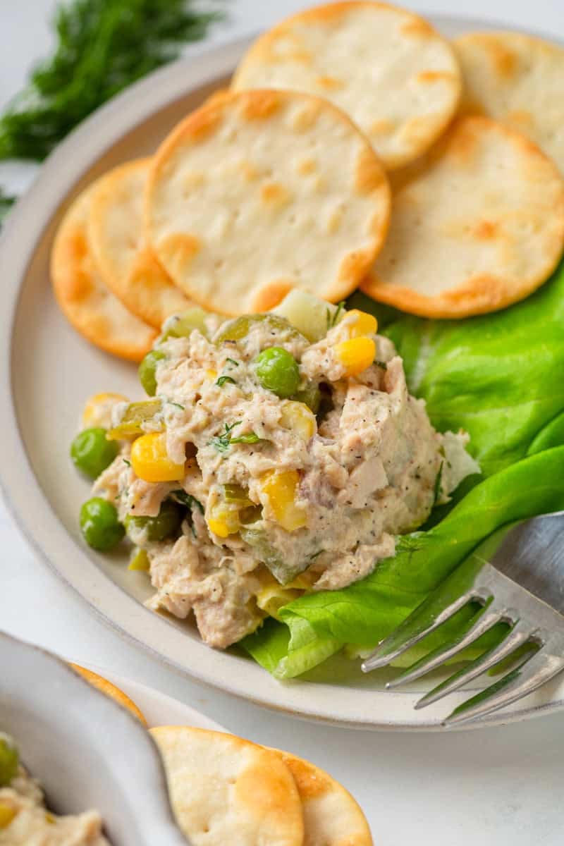 Viral tuna salad on lettuce with more in a bowl in front of it.