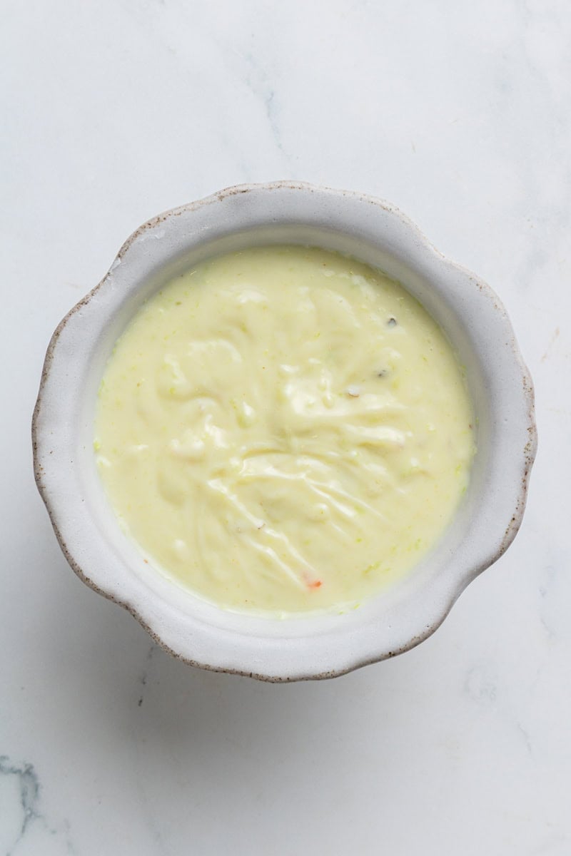 Tuna salad mayo dressing in a bowl.