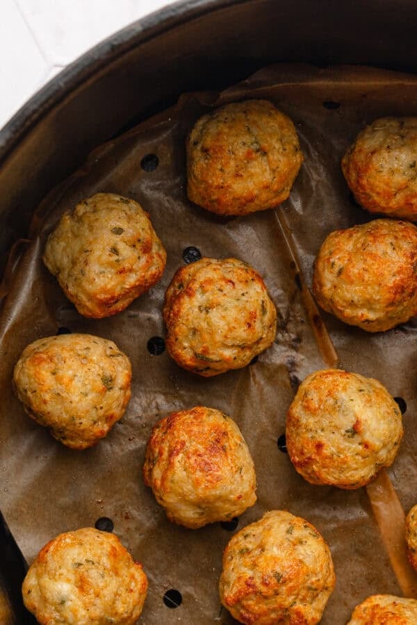 Air fried chicken meatballs in air fryer.