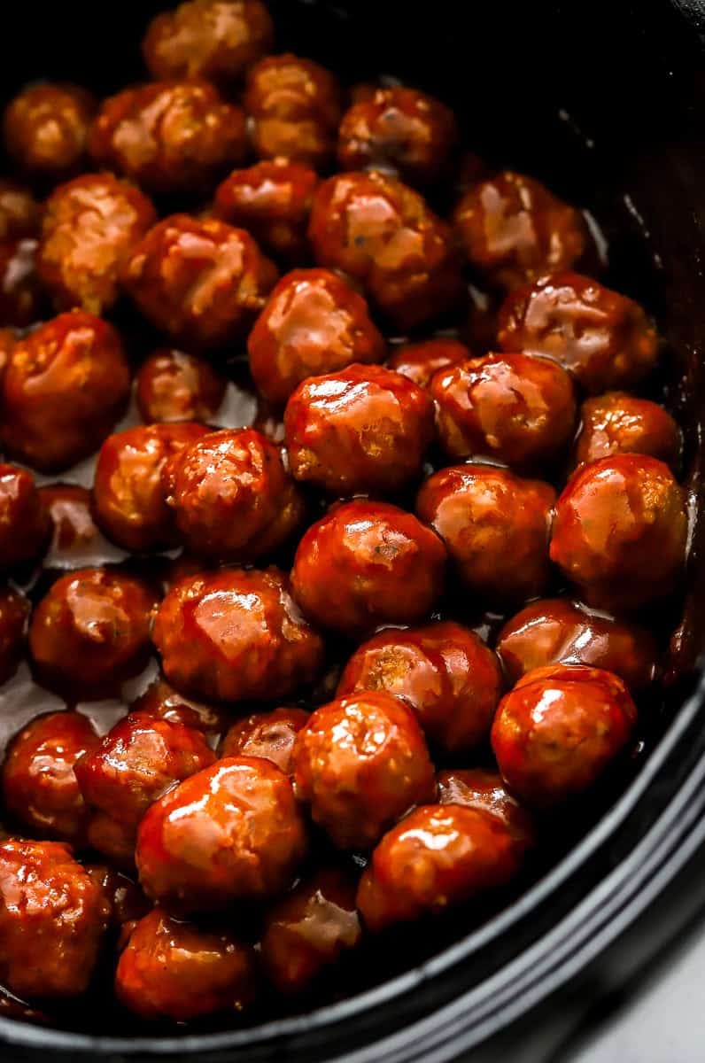 Cooked BBQ meatballs in a crockpot. 