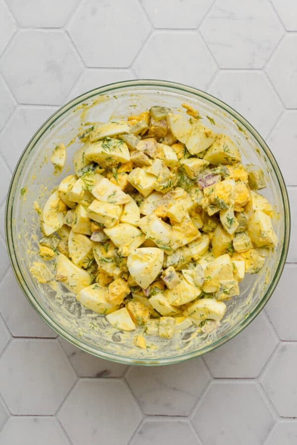 Egg salad mixed in a glass bowl