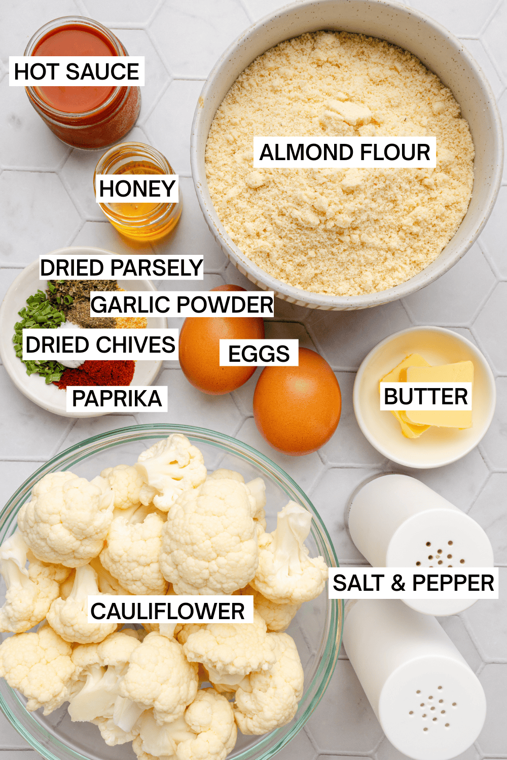 Ingredients for air fryer buffalo cauliflower in bowls with labels over each ingredient.