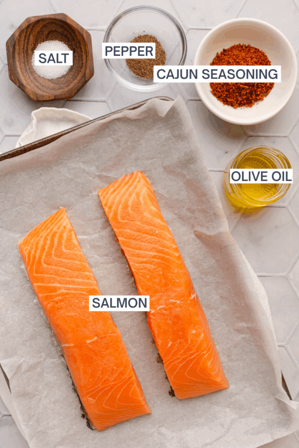 Ingredients for air fryer cajun salmon with labels over each ingredient.