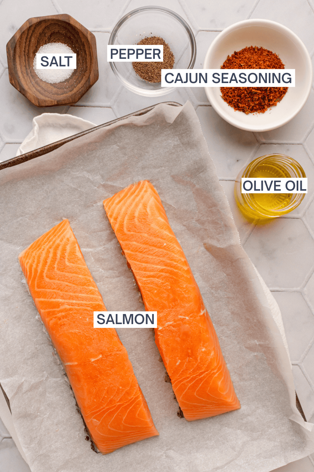 Ingredients for air fryer cajun salmon with labels over each ingredient. 